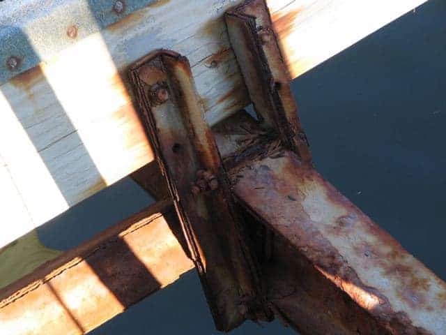 Cracked bunks and rusty galvanized cradles.