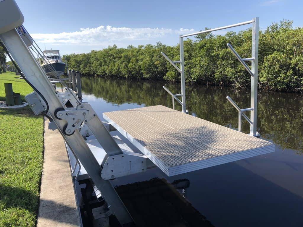 Boat Lift Accessories for Lifting, Docking, Storing and Making Repairs - image Elevator-deck-lift-with-access-platform-and-kayak-rack-1024x768 on https://www.iqboatlifts.com